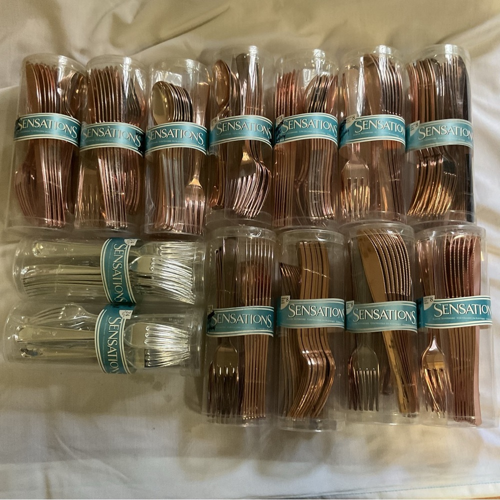 $40. NEW (130)pc. “SENSATIONS” SILVER and ROSE GOLD/COPPER CUTLERY.